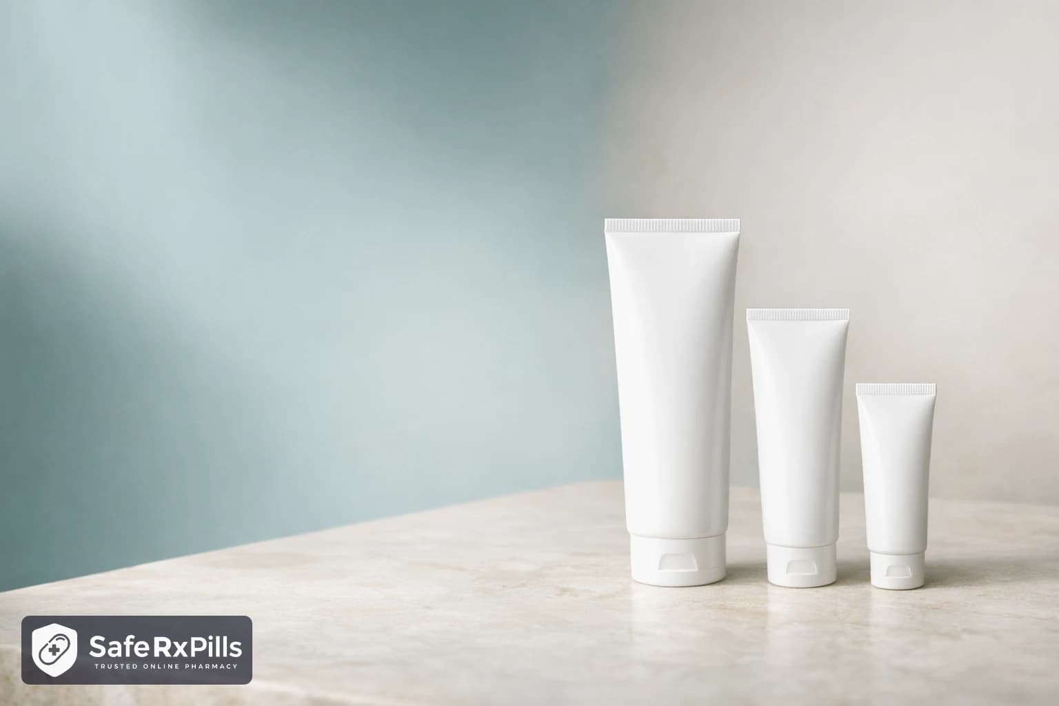 Three plain white cream tubes of decreasing size standing in a row on a pale stone surface in soft daylight